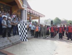 Bertabur Hadiah Ribuan Warga Ikuti Gerak Jalan Santai Bersama Bupati Kuansing.