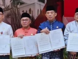 Asisten I, dr. Fahdiansyah, SPOG, Hadiri Penandatanganan Perjanjian Pinjam Pakai Barang Milik Daerah Pemerintah Provinsi Riau kepada Pemerintah Kabupaten/Kota